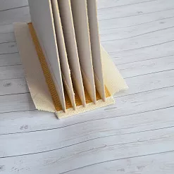 Переплет на 6 разворотов, с листами 20х25, цвет золотой, шаг 0,7 см 